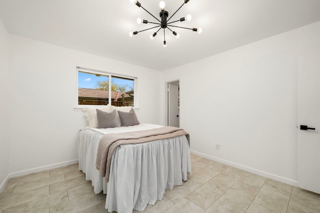 bedroom featuring light tile patterned floors and a notable chandelier