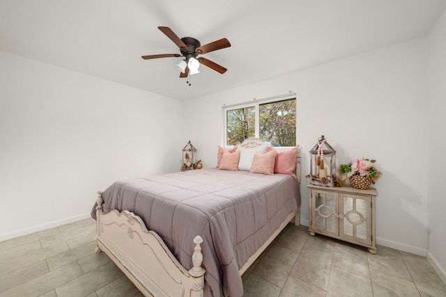 bedroom featuring light tile patterned floors and ceiling fan