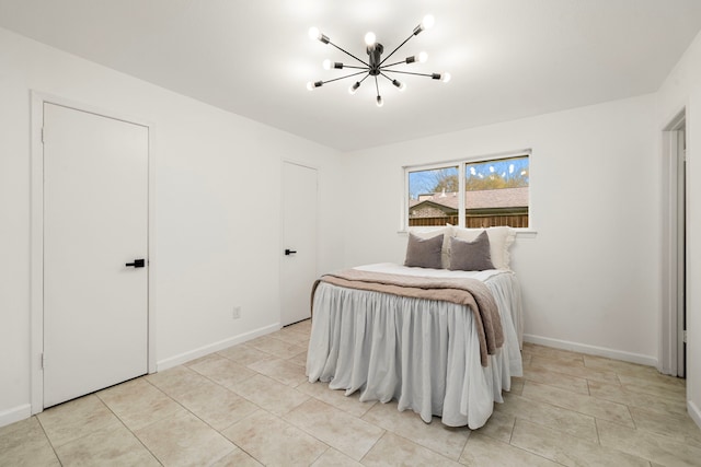 bedroom with light tile patterned flooring and a notable chandelier