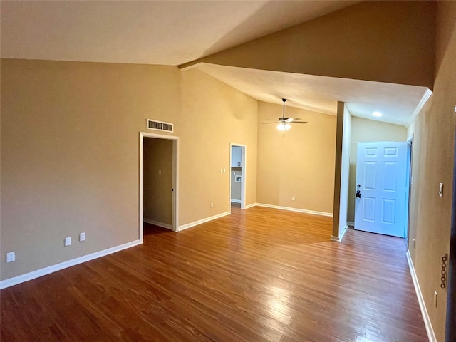 empty room featuring ceiling fan, hardwood / wood-style floors, and lofted ceiling