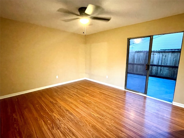 empty room featuring hardwood / wood-style flooring and ceiling fan