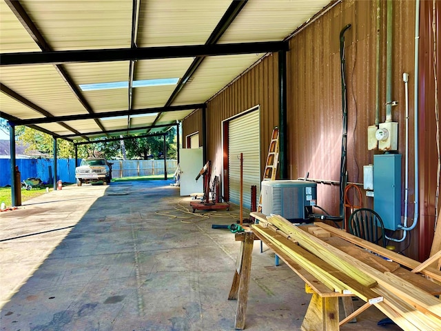 8766 Beauxart Garden Rd, Beaumont, TX 77705 - view of patio / terrace with fence, an attached carport, and central air condition unit