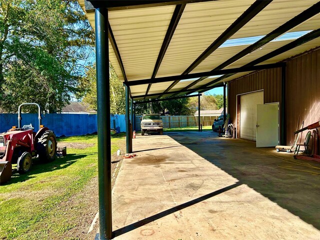 8766 Beauxart Garden Rd, Beaumont, TX 77705 - view of patio / terrace featuring a carport and fence