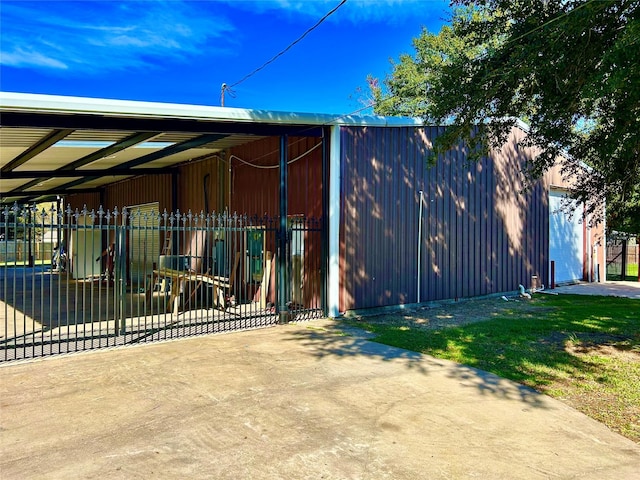 8766 Beauxart Garden Rd, Beaumont, TX 77705 - view of property exterior featuring a carport and an outbuilding