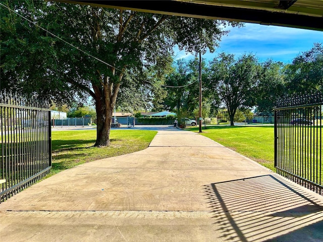 8766 Beauxart Garden Rd, Beaumont, TX 77705 - view of home's community with a lawn and fence