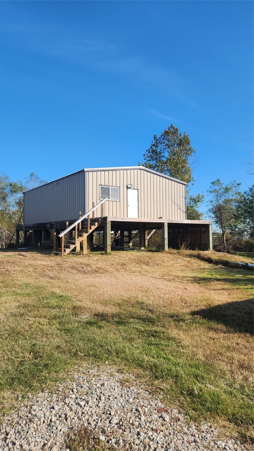 view of outbuilding with a lawn