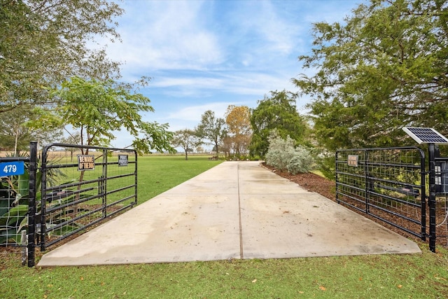 view of property's community with a yard