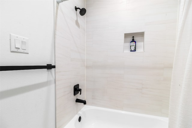 bathroom with shower / bath combo