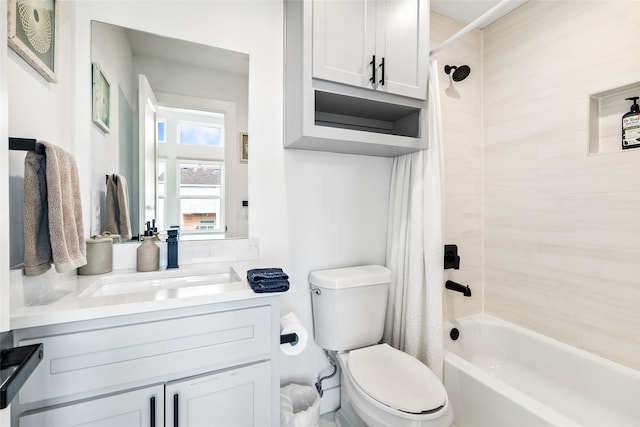 full bathroom featuring vanity, toilet, and shower / bath combo with shower curtain