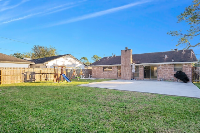 view of yard with a playground and a patio area