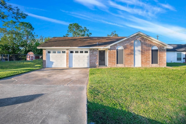 ranch-style house featuring a front yard and a garage