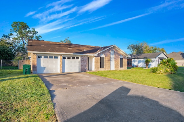 ranch-style home featuring a garage and a front yard