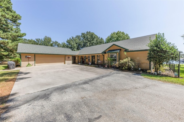 ranch-style home featuring a garage