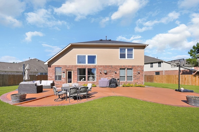 rear view of house featuring a lawn, outdoor lounge area, and a patio