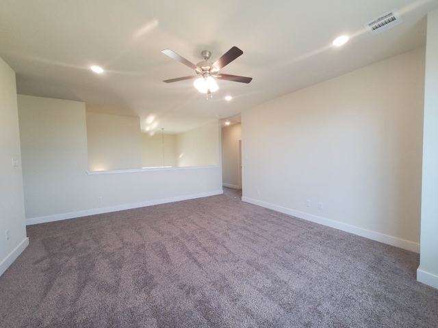 carpeted empty room featuring baseboards, recessed lighting, visible vents, and a ceiling fan