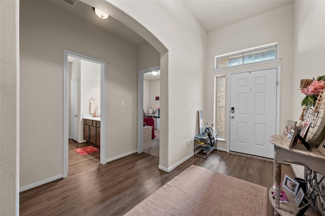 foyer with dark hardwood / wood-style floors