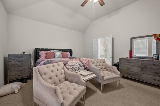 carpeted bedroom with ensuite bathroom, ceiling fan, and lofted ceiling