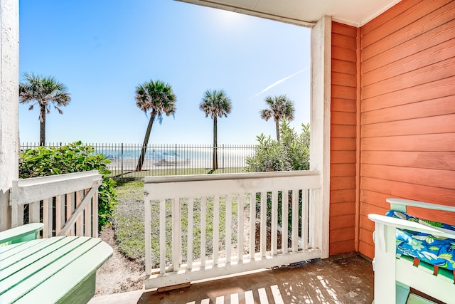 balcony featuring a water view