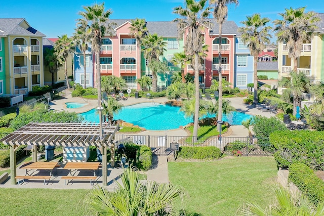 view of swimming pool with a pergola, a yard, and a patio