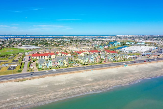 bird's eye view featuring a view of the beach and a water view