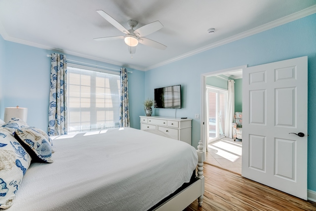 bedroom featuring light wood-type flooring, ceiling fan, and ornamental molding