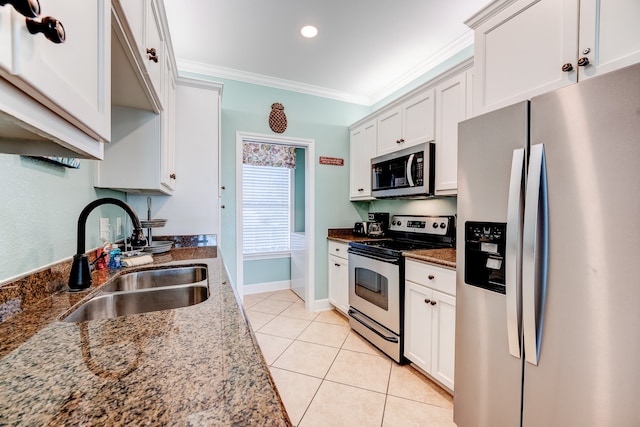 kitchen featuring stone counters, white cabinetry, sink, and appliances with stainless steel finishes