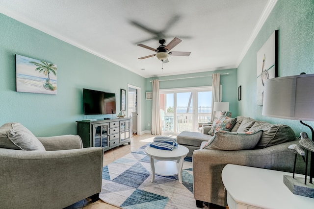 tiled living room featuring ceiling fan and ornamental molding