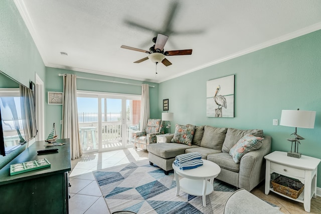 tiled living room with a wealth of natural light, ornamental molding, and ceiling fan