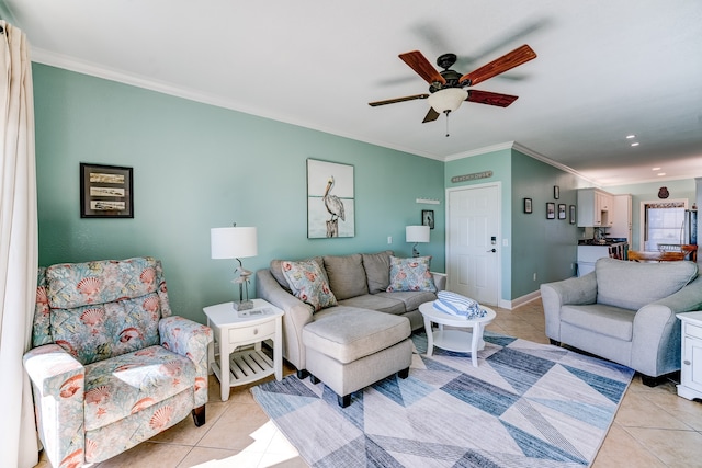 living room featuring light tile patterned floors, ceiling fan, and ornamental molding