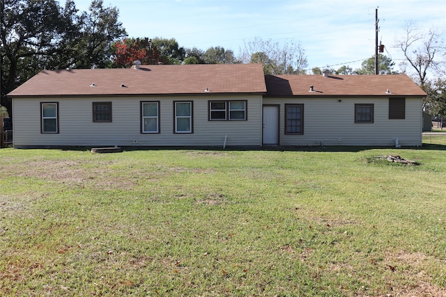 back of property with a yard