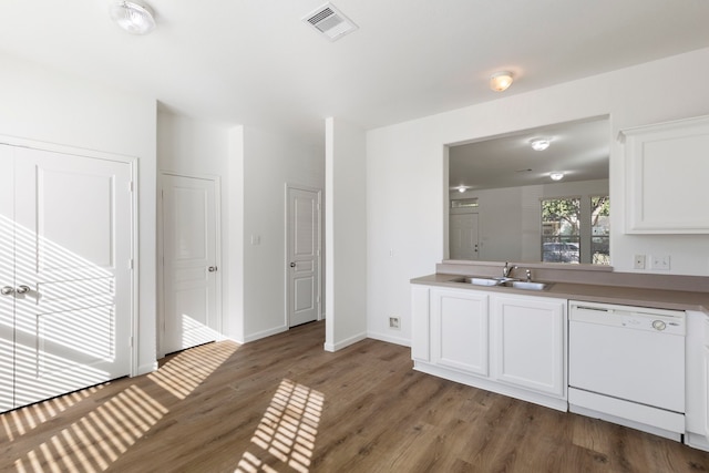 interior space featuring white cabinetry, dishwasher, dark wood-type flooring, and sink