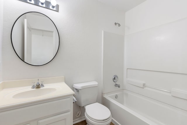 full bathroom featuring vanity, bathing tub / shower combination, and toilet