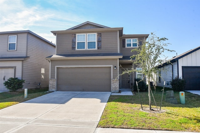 view of front facade with a garage and a front lawn