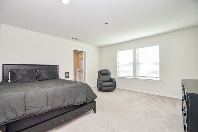 carpeted bedroom with ensuite bathroom