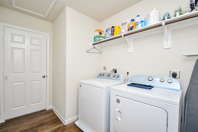 laundry area featuring separate washer and dryer and dark hardwood / wood-style floors