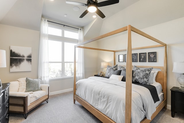 carpeted bedroom featuring ceiling fan and lofted ceiling