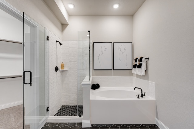 bathroom with tile patterned floors and separate shower and tub