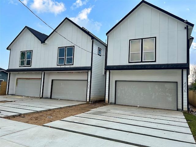 modern inspired farmhouse with a garage