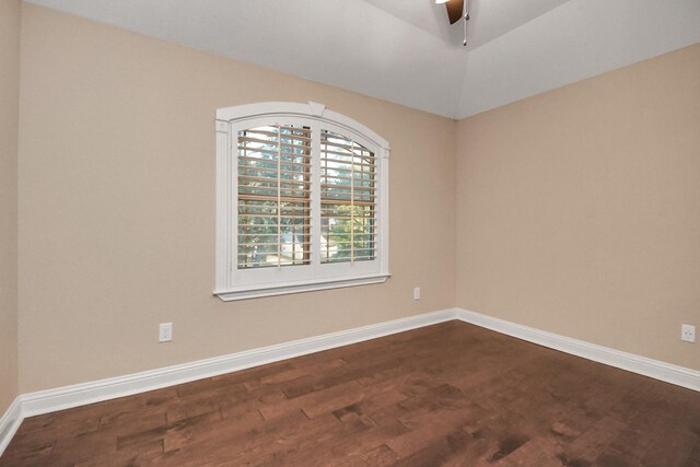 empty room featuring ceiling fan and dark hardwood / wood-style flooring