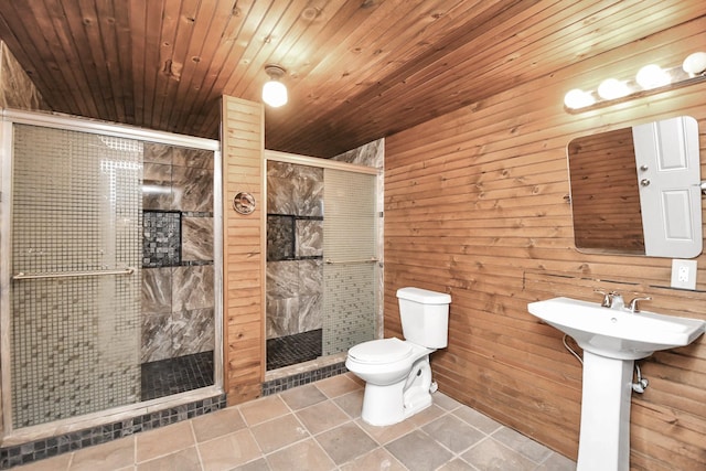 bathroom with tile patterned floors, toilet, wood ceiling, and wood walls