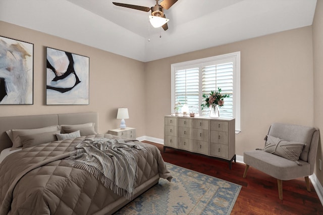 bedroom with ceiling fan and dark hardwood / wood-style flooring