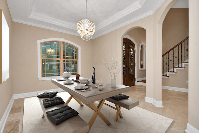 office space featuring a notable chandelier, a raised ceiling, and crown molding