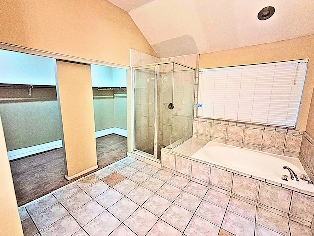 bathroom with independent shower and bath, tile patterned flooring, a baseboard heating unit, and vaulted ceiling