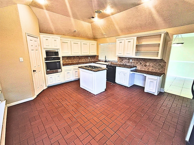 kitchen with black appliances, white cabinetry, a center island, and vaulted ceiling