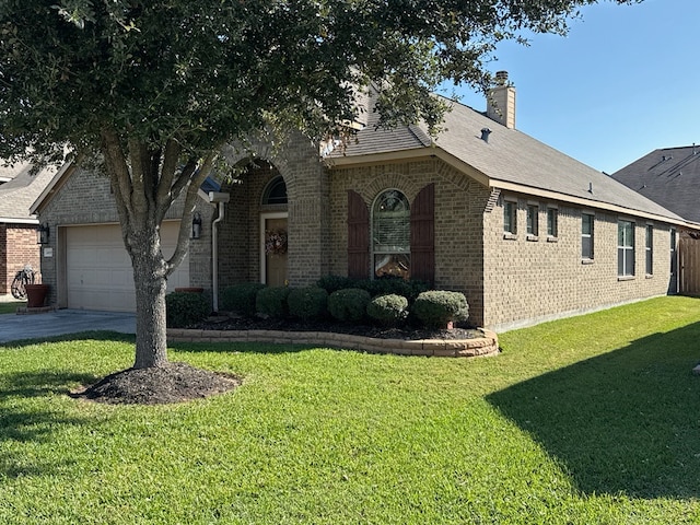 view of front facade with a front lawn and a garage