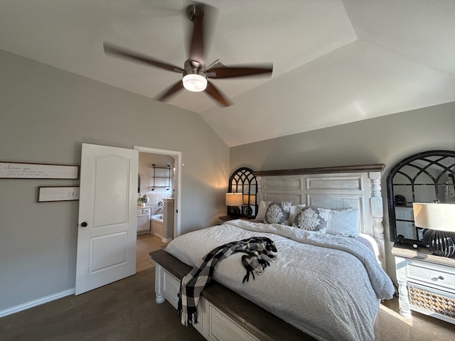 carpeted bedroom with ensuite bathroom, ceiling fan, and lofted ceiling