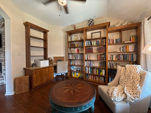 sitting room featuring ceiling fan and dark wood-type flooring