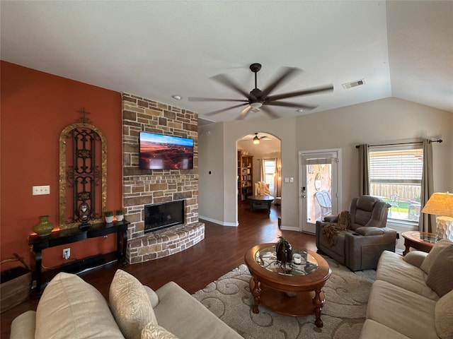 living room with a fireplace, hardwood / wood-style floors, ceiling fan, and lofted ceiling