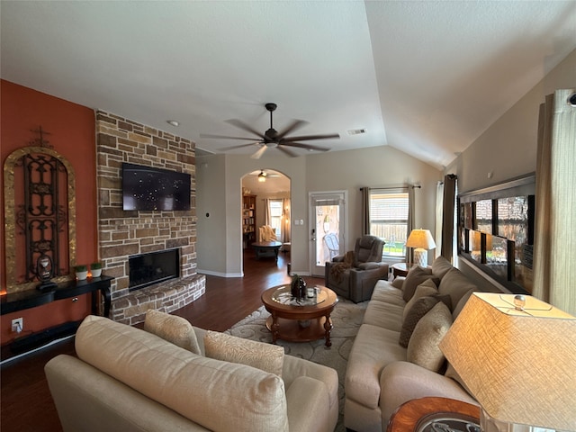 living room with a fireplace, ceiling fan, hardwood / wood-style floors, and lofted ceiling