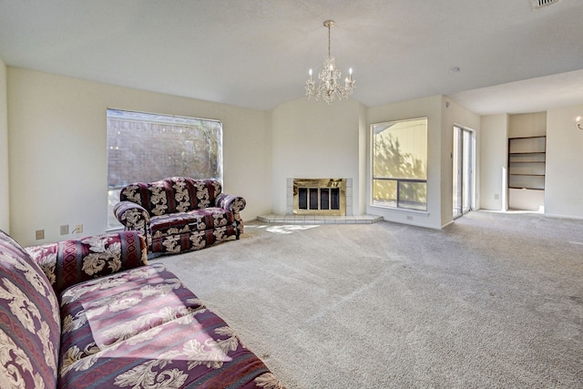 carpeted living room with a chandelier